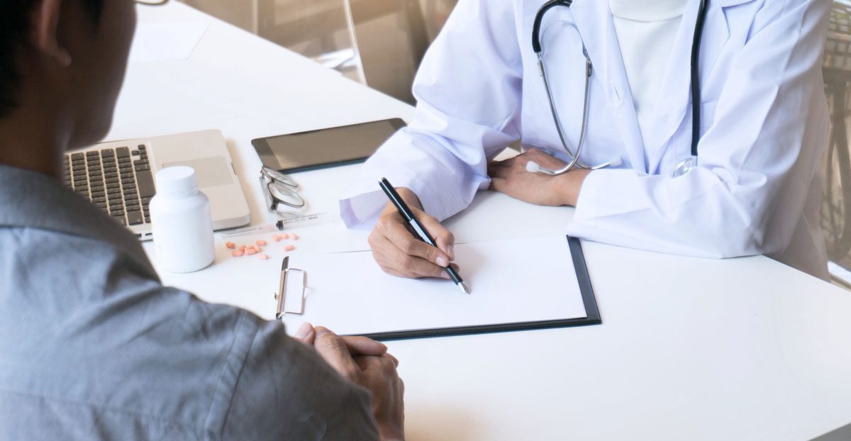 Doctor-consultation-with-patient-at-medical-office Doctor-consultation-with-patient-at-medical-office